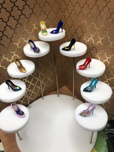 there are many pairs of high heel shoes on display