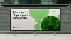 a large advertisement on the side of a building that says take care of your plants intelligently