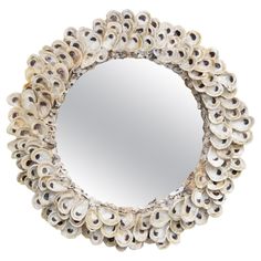 a circular mirror made out of shells