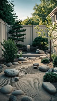 a garden with rocks and trees in it