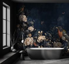 a bath tub sitting next to a window in a room with flowers on the wall