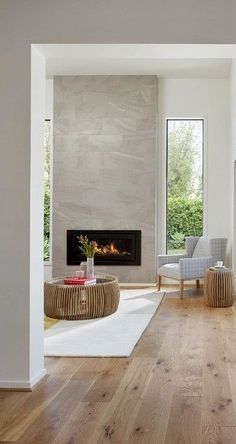 a living room filled with furniture and a fire place