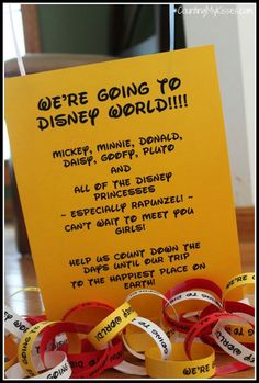 there is a sign that says we're going to disney world with ribbons around it