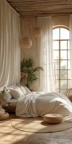 a bed with white sheets and pillows in a room next to two large windows that look out onto the ocean