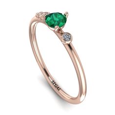 Pretty minimalist thin ring in perfect proportions and style can be used as a gift for your loved one. Minimalist style with immensely beautiful Emerald enhances the beauty of this ring. This ring would express love to your loved one. Stock Number: 1822 Metal Setting Metal Type: 14K Rose Gold Main Stone Type: 100% Natural Green Emerald Size: 0.25Ct / 4mm Shape: Round Cut Color: Green Clarity: SI (Eye Clean) Additional Stones Stone Type: Natural Conflict-free Diamonds Number / Total Weight: 2 Sto Statement Engagement Ring, Vintage Engagement Rings Sapphire, Edwardian Ring, Ruby Bands, Express Love, Black Diamond Engagement, Vintage Sapphire, Vintage Style Rings, Black Diamond Ring Engagement