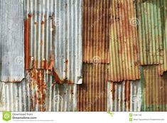 an old rusty metal wall with peeling paint and rust stains on it stock photo - image