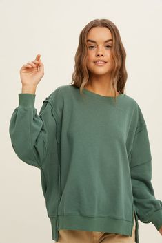 Colors: Elevate your basics with this pullover! This french terry sweatshirt is featured with raw edge detailing, side slits, crew neckline, and a lush feel. We like pairing this pullover with sweatpants or leggings for a casual fit or with some high rise denim. This pullover will be such a staple to your wardrobe. green raw edge detailing side slits long sleeves french terry sweatshirt relaxed fit self: 85% cotton, 15% polyester contrast: 65% cotton, 30% polyester, 5% spandex American Flag Sweatshirt, Green Sweatshirt, Round Neck Sweaters, Cold Season, Clothing Essentials, High Rise Denim, Casual Fit, Raw Edge, Aesthetic Outfits