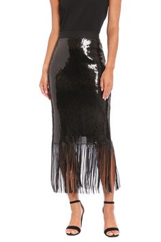 Make a dazzling statement in our Chelsea sequin fringe midi skirt. This show-stopping piece features an alluring sequin-covered body that catches the light with every move, culminating in a playful fringe hem that swings as you walk. Perfect for New Year's Eve parties, cocktail soirées, or any event where you want to shine. For a more subdued look, team it with a simple silk camisole. The Chelsea skirt effortlessly transitions from dinner to the dance floor, ensuring you're the muse of every occ Fall Party Midi-length Bottoms, Glamorous Midi Skirt For Evening, Glamorous Midi-length Evening Skirt, Elegant Party Bottoms With Tassels, Spring Party Sequin Dress With Fringe, Fall Party Midi-length Skirt, Fall Party Midi Skirt, Elegant Party Skirt With Tassels, Sequin Fringe Dress For Night Out Party Season