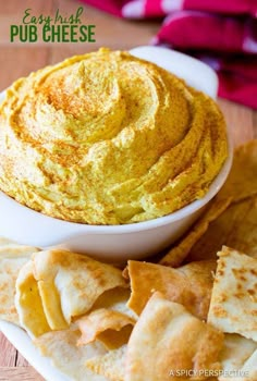 hummus and pita chips on a plate with text overlay that reads easy dip cheese