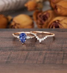 "MADE TO ORDER * Material: Solid gold(14K/18K white/yellow/rose gold) * DETAILS  Engagement ring - center stone: Lab sapphire 6*8mm pear cut - width: approximately 1.5mm  - thickness: approximately 1.3mm Side stone:Moissanite or Diamond - diamond:0.16ct,2*3mm pear cut,Color G-H,Clarity SI-VS - moissanite:0.16ct Wedding band Stone:Moissanite or diamond - diamond:2*3mm Pear cut Half eternity,Color G-H,Clarity SI-VS - moissanite:2*3mm Pear cut Half eternity, * Click on the \"Pin It\" icon if you li Saphire Engament Ring Teardrop, Sapphire Engagement Ring Pear Shaped, Pear Gemstone Engagement Ring, Teardrop Sapphire Ring, Sapphire Teardrop Ring, Pear Cut Sapphire Engagement Ring, Pear-shaped Sapphire Diamond Ring As Gift, Sapphire Pear Engagement Ring, Pear Sapphire Engagement Ring