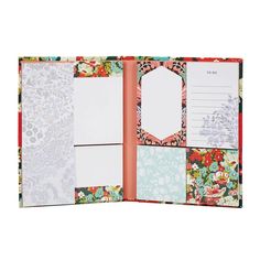 the inside of an open planner book with floral designs and blank notes on it,