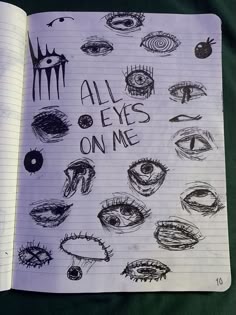 an open notebook with drawings on it and the words all eyes on me written in cursive writing