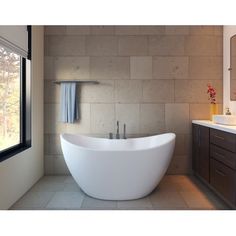 a large white bath tub sitting next to a window