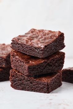 chocolate brownies stacked on top of each other