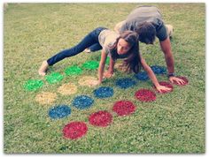 two people laying on top of a grass covered field next to an image of circles