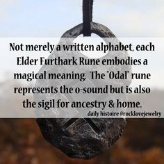 a rock hanging from a hook with a quote about the poem, not merly written alphabet