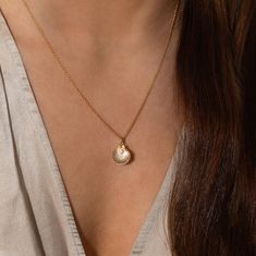 Description: A delicate shell pendant housing the sweetest little surprise in the form of a freshwater pearl. The Ariel necklace is one you wont want to take off. Details:  Pendant Measurement: 10mm Pearl Measurement: 3mm Material: Freshwater Pearl & Goldfill Chain Length: 16" Shell With Pearl Necklace, Shell With Pearl, Ariel Necklace, Shell Pendant, Chain Lengths, Chain Length, Ariel, Fresh Water, Freshwater Pearls