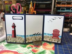 an open card with two pictures of a lighthouse and a red chair on the beach