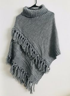 Steve Madden Women's Cable Knit Poncho Heather Grey One Size NWT You wear over a sweater Winter Knitted Acrylic Poncho, Gray Knitted Sweater One Size, Gray Knitted One-size Sweater, One-size Knitted Gray Sweater, Casual Knitted Shawl Poncho, One Size Gray Knitted Sweater, Casual Knitted Poncho Shawl, Winter Acrylic Yarn Poncho, Casual Shawl Sweater For Winter