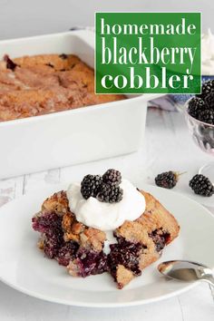 homemade blackberry cobbler on a white plate with a bowl of blackberries in the background