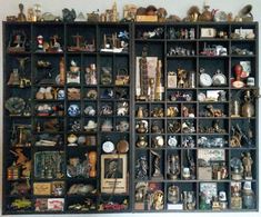 a wall filled with lots of different types of clocks and figurines on shelves