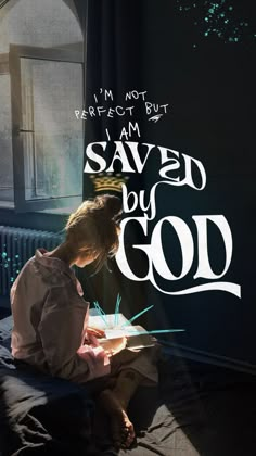 a person sitting on a bed writing with the words i'm not perfect but i am saved by god