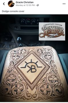 an image of a car dashboard cover with the letter b on it