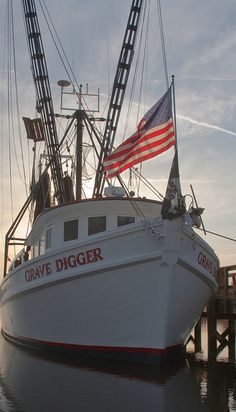 a large white boat with an american flag on it