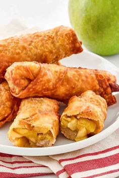 apple turnovers on a plate next to an apple