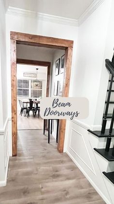 the entrance to a house with stairs leading up to it and a sign that reads beam doorways