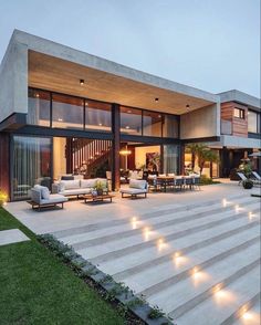 a modern house with stairs leading up to it