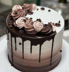 a cake with chocolate icing and flowers on top