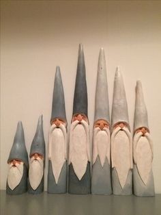 seven gnomes are lined up next to each other