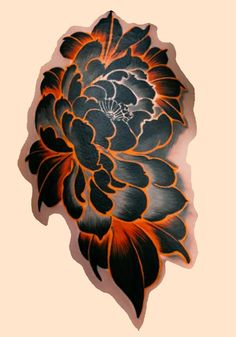 an orange and black flower tattoo on the back of a woman's arm,