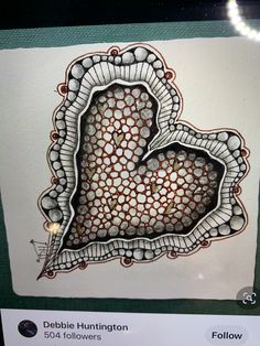 a drawing of a heart in the middle of a piece of paper with circles on it