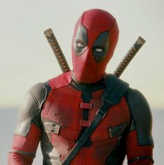 a deadpool character with two swords in his hands