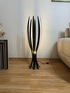 a lamp that is on top of a wooden floor