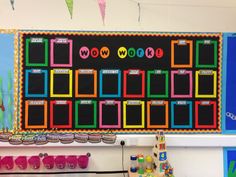 a bulletin board with different colors on it in a school classroom or playroom for children