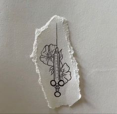 a piece of paper with a drawing of a thermometer and flowers on it