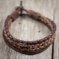 "Mens leather cord surfer bracelet - Handmade with dark and light brown 3mm braided leather cord, 2.5mm dark brown leather cord, and a pewter clasp bead. I use a bead and loop style clasp which is secure and guaranteed to stay clasped. Rugged, timeless, and durable... as a man's bracelet should be. I use only the highest quality leather cord available on the market. It obtains its color through a natural dye process, which enables it to maintain its rich, natural leather look and feel. I use a h Masculine Adjustable Braided Bracelets With Leather Strap, Masculine Adjustable Braided Leather Bracelet, Brown Handmade Leather Bracelet With Waxed Cord, Handmade Waxed Cord Braided Bracelet, Brown Waxed Cord Wrap Bracelet As Gift, Handmade Brown Leather Friendship Bracelet, Men’s Leather Bracelet, Casual Brown Leather Braided Bracelets, Casual Brown Leather Strap Braided Bracelet