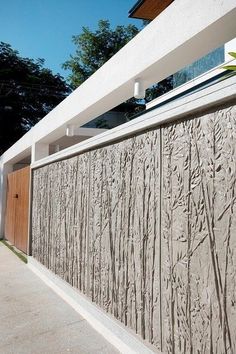 the side of a house that is made out of concrete