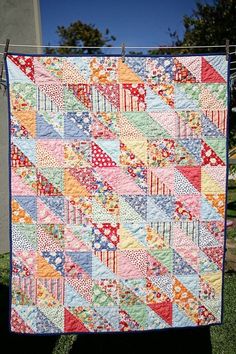 an image of a colorful quilt on the front page of a magazine, with text overlay