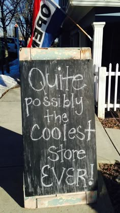 a chalkboard sign that reads quite poshy the coolest store ever