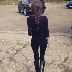 a woman with long hair and black boots