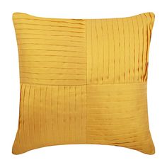 a yellow pillow with pleated lines on it