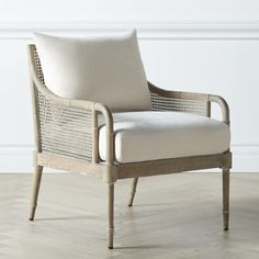 a white chair sitting on top of a hard wood floor