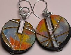 Our earrings are designed, painted, laser cut and assembled all by us here in St. Louis. These Tiny Paintings are truly unique (no two pair are the same).  Made from up-cycled wood and plexiglass, they are lightweight and extremely wearable and can be dressed up or down. They would make a great gift for someone, or just a treat for yourself! 1 inch diameter; silver earwire. Tiny Paintings, Earrings Wood, Jewelry Flower, Painted Earrings, Painted Jewelry, Polymer Crafts, Paintings Art, Art To Wear, Wood Jewelry