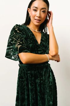 Say hello to our Uma Velvet Maxi Dress! This gorgeous dress features dark green velvet material with a unique burnout mesh floral print. Green Midi Dress With Surplice Neckline For Evening, Maxi Dress Dark, Luxurious Dresses, Baltic Born, Velvet Maxi Dress, Velvet Maxi, Guest Attire, Wedding Attire Guest, Flowy Shorts