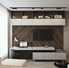 a modern living room with white furniture and wood paneling on the wall, along with a flat screen tv