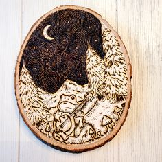 a piece of wood with an image of a dog and cat on it